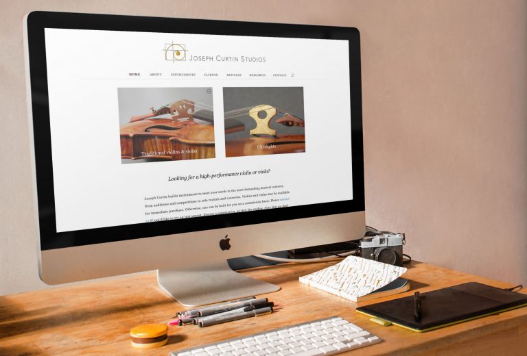 Joseph Curtin Studios website displayed on a desktop iMac