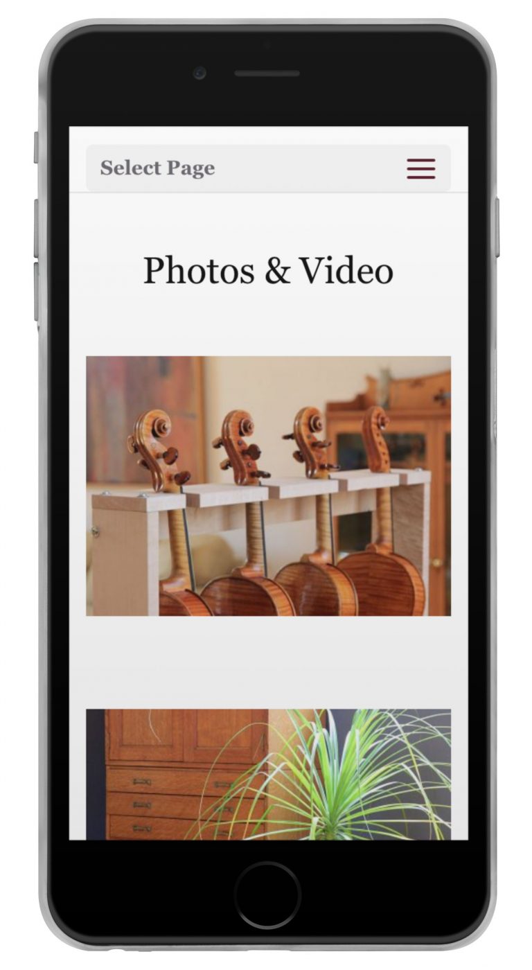 Joseph Curtin Studios website displayed on an iPhone
