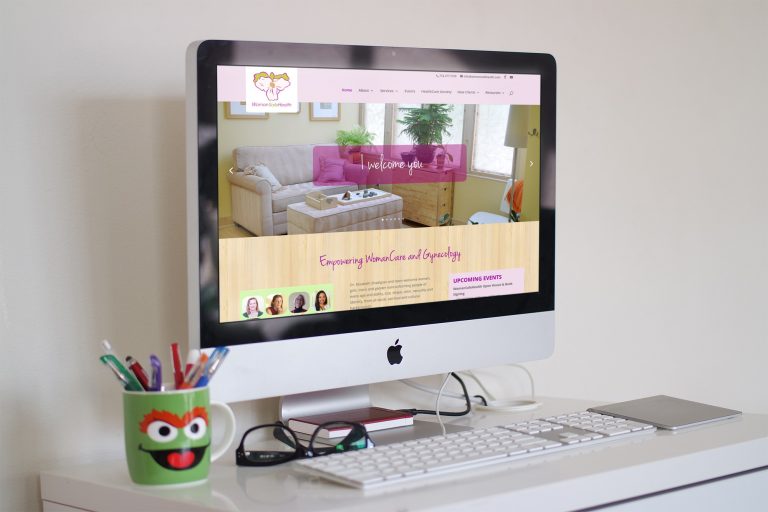 WomanSafeHealth site displayed on iMac desktop computer